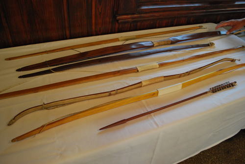 A collection of bows and arrows, all of which were hand made by Mr. Phil Cross himself