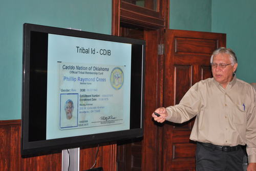 Mr. Phil Cross displays his US Tribal ID card, which portrays himself as a member of the Caddo Nation
