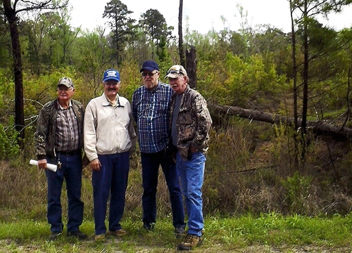 Willard McInnis, Rickey Robertson, Wayne Duke, and Homer Lynn Brown at the homesites of J.R. Brown and Thomas McInnis on Peason Ridge. (Rickey Robertson Collection)