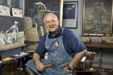 Alan Bean sitting at the easel with brushes, 2008