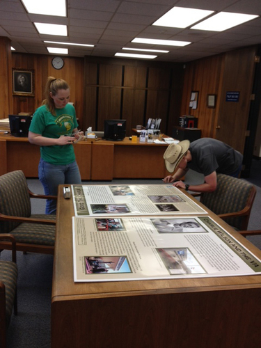 Public History graduate students Joyce Pitts and Jake McAdams working on the exhibit
