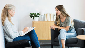 young woman talking with a counselor