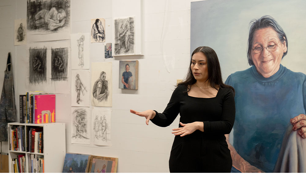 Arely Morales talking in her studio