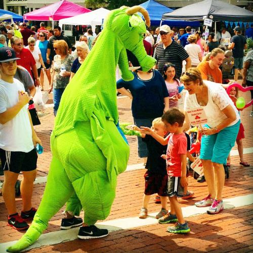 Schlaftnicht the dragon greets children at the Blueberry Festival