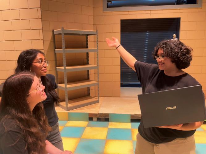 “Real Women Have Curves” stage manager Michelle Guerrero discusses the play with cast members Hannah Marfin and Xitlali Chavez-Aponte during rehearsal.