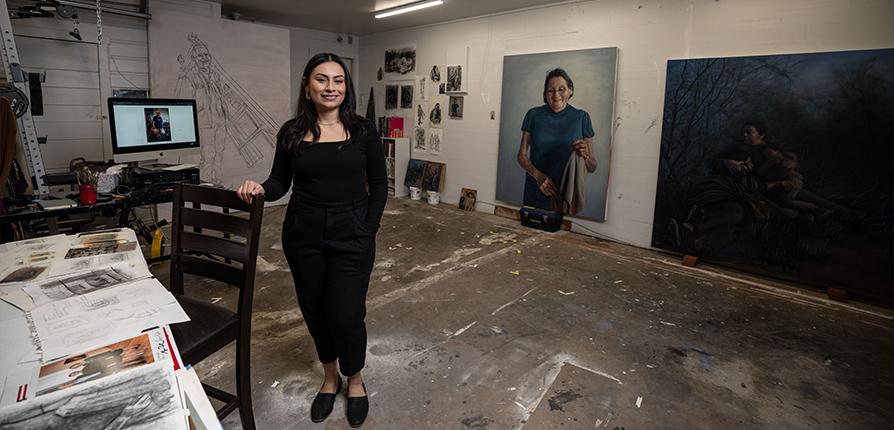 Arely Morales standing inside her studio