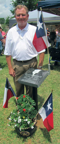 Michael Brenner of Houston County Monument Co. in Crockett stands by the memorial he created for the late Eliza Bishop, Houston County's foremost historian.