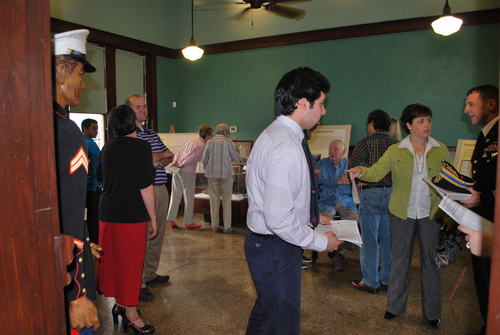 Patrons in the main area viewing the exhibit.