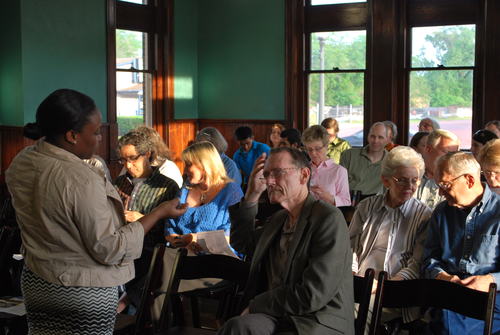 Damika Thomas (Left), who works in the Center for Regional Heritage Research, speaks with a patron concerning the event.