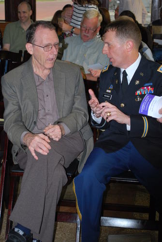 LTC Reichert (Right) speaks with a patron.