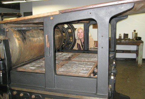  Deborah Burkett inspects the press forms from the last printing of the Alto Herald on July 27, 1978. The paper was published until that time on a 1919 Miehle press, capable of printing four pages on one sheet of paper. 