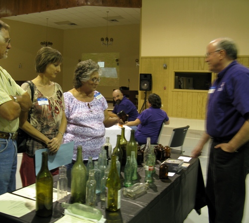 Dr. George Avery Bottle collection display table