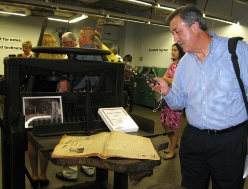 Robert Gonzales, Advertising/Sales Director of the Rusk Cherokeean/operates the radio arm of the business--KTLU AM and KWRW FM photographs the March 23, 1972 the Alto Herald front page featuring Emmett Whitehead, former publisher of the Rusk Cherokeean.