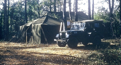 Army campsite near Peason, Louisiana during Exercise Sage Brush with a new 1955 jeep parked in front of tent (Rickey Robertson Collection)