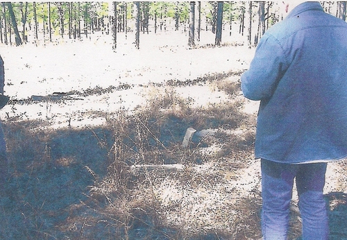 Skip Cryer looking at the possible grave site of 3 African-American workers at the Peavy-Wilson Corral Site.