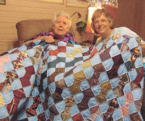 Sylvia Evans Brown pictured with her cousin Patsy Robertson holding the beautiful handmade quilt (Rickey Robertson Collection)