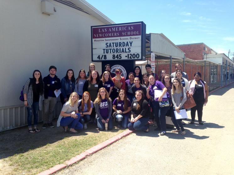SFA students at Las Americas Middle School in Houston with Dr. Mary Catherine Breen, associate professor of secondary education and educational leadership at SFA. 