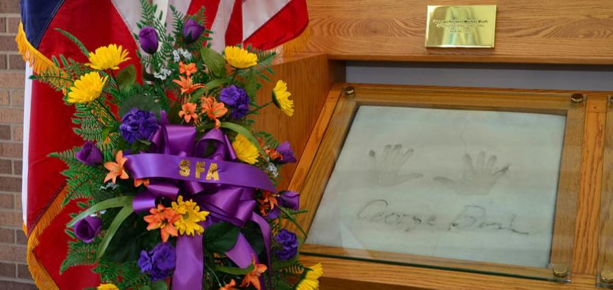 Flowers with the handprints of President George H.W. Bush