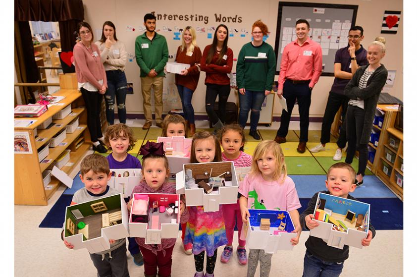 SFA interior design studens with prekindergarten children in the Early Childhood Lab