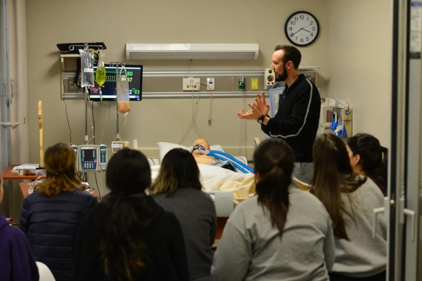 an SFA clinical instructor addresses a group of students