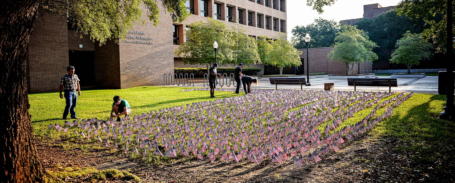 SFA's Young Conservatives of Texas and volunteers place 2,977 American flags — one for each person who died during the terrorist attacks Sept. 11, 2001 — outside the McKibben Education Building to commemorate the 19th anniversary. Photo by Robin Johnson