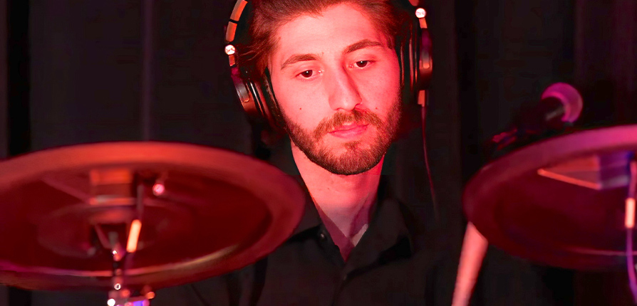 Student playing electric drums