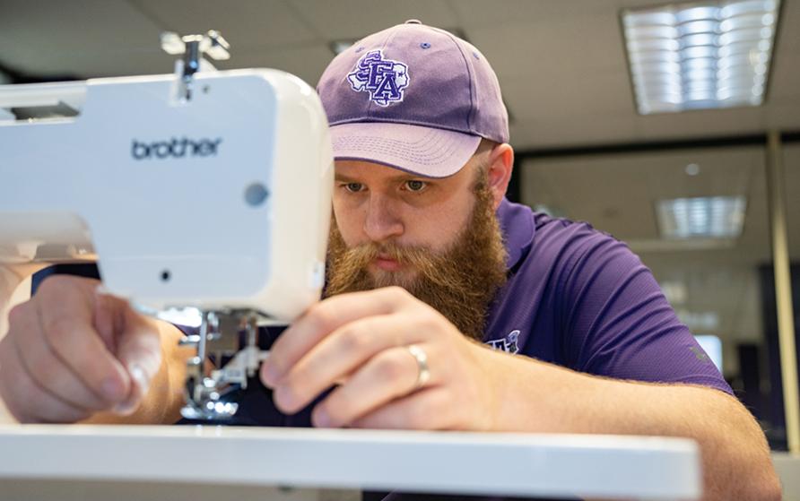 Employee using sewing machine