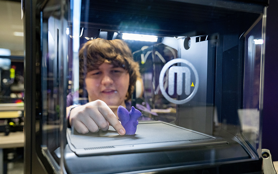 Student 3D printing a squirrel