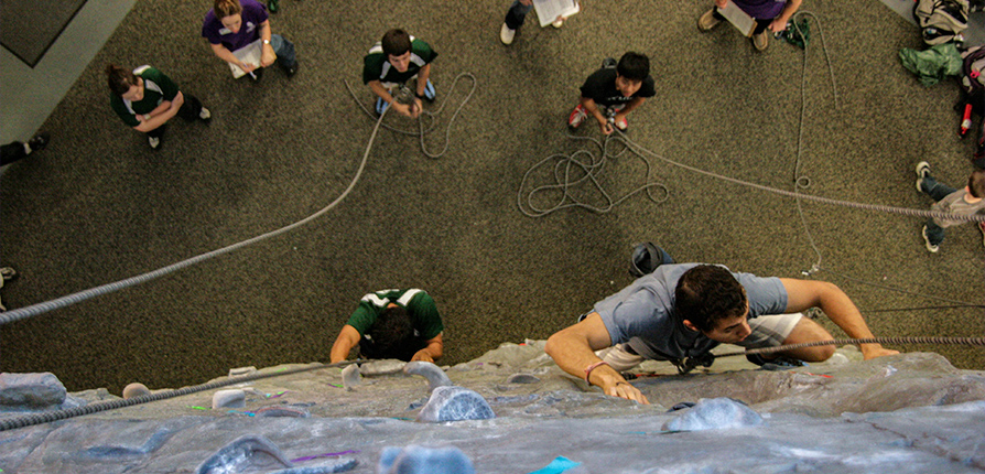 Students climbing the rock wall