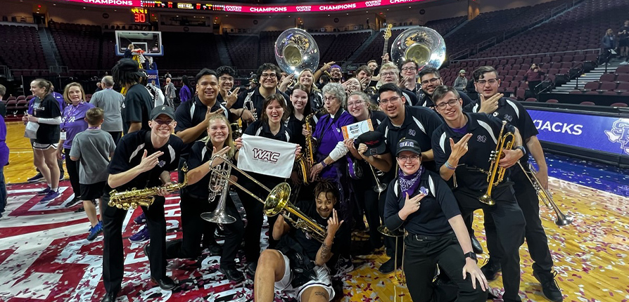 Roarin' Buzzsaws bands celebrating the women's basketball WAC championship win
