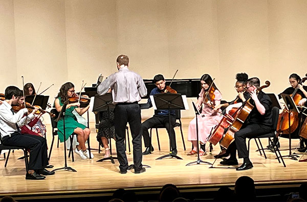 Students performing in an orchestra
