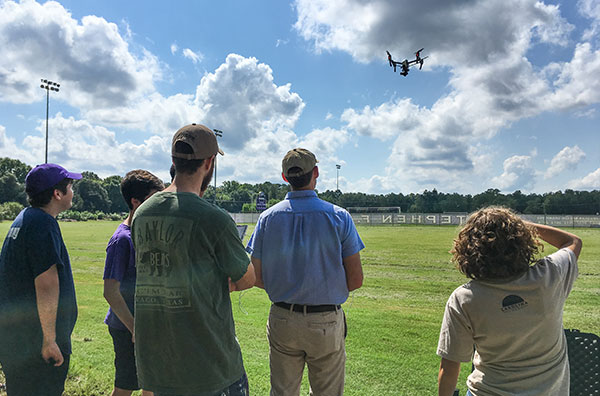 Students watching drone