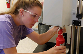 Chemistry student in lab working with instrumentation