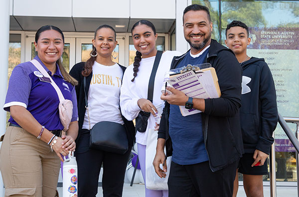 Family smiling during a tour