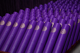 Diploma tubes at commencement ceremony