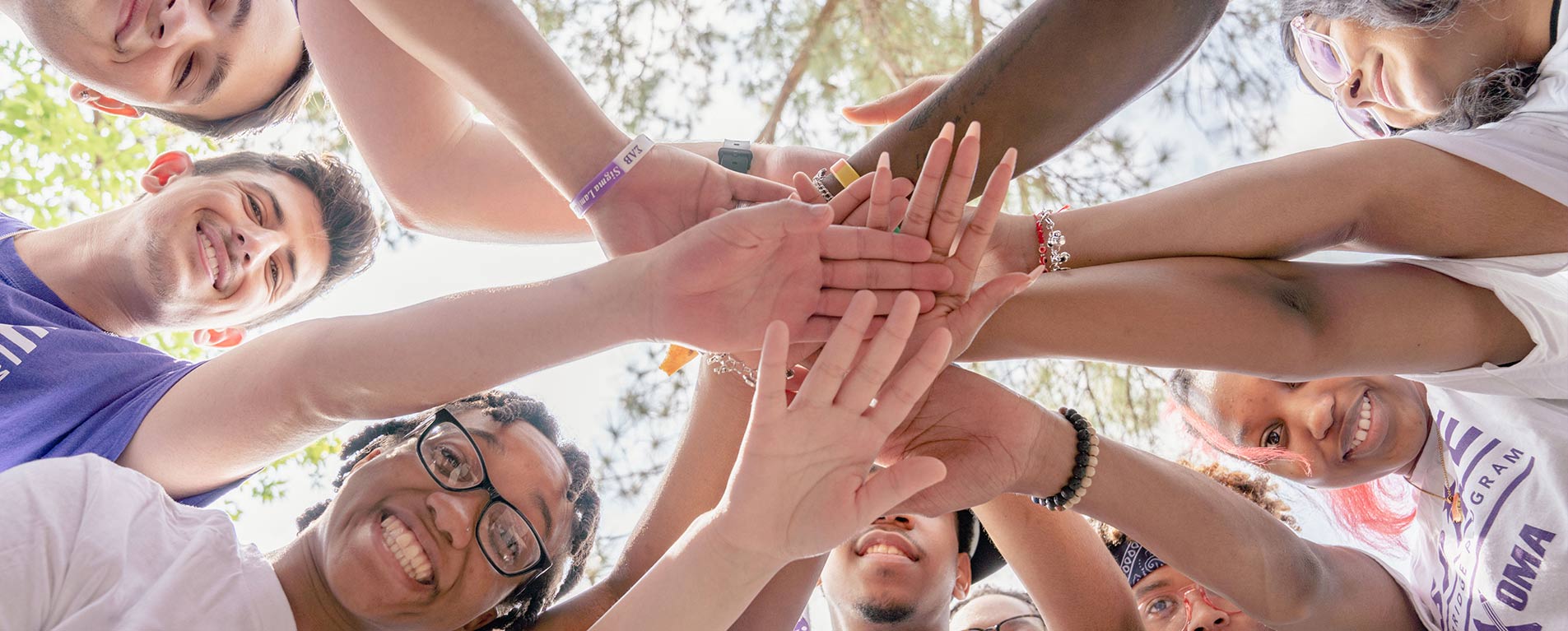 students all hands in