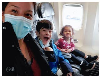 Céspedes and her two children on airplane