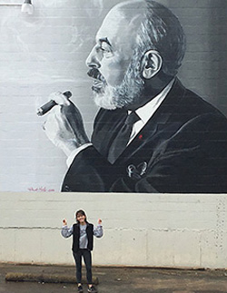 Brent Hale '81 and his daughter, Grace (Hale) Reese, pictured, painted the Stanley Marcus mural in the Cedars district of Dallas.