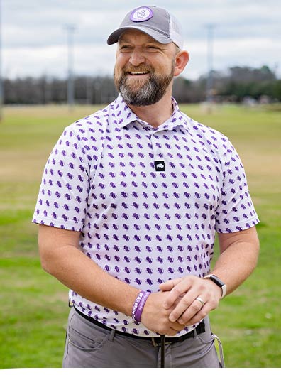SFA student-athlete Jonathan Shuskey wears a polo shirt and hat from Last Stand Hats’ SFA apparel line. Shuskey’s play on the golf course and his unique story — a 41-year-old, 20-year U.S. Army veteran who is pursuing collegiate golf and a bachelor’s degree following his military retirement — helped him gain an NIL deal with Last Stand Hats shortly after enrolling at SFA.