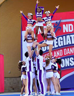 The coed cheer team performs a pyramid during the 2019 College National Championships in Daytona, Florida. Photo by Hardy Meredith '81