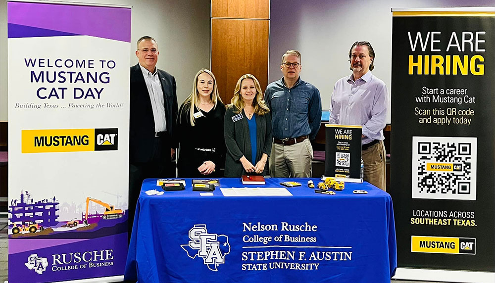 Mustang Cat representative posing with Dean Bisping, Dr. Wright, Dr. Kouliavtsev and Dr. Crocker