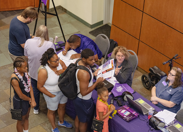Student and family checking in to Orienation