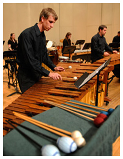 student playing percussion