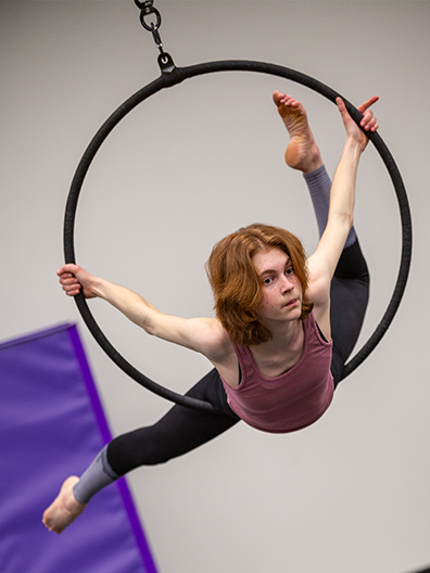 A dance student uses the newly installed aerial hoops to deliver an unforgettable athletic and acrobatic performance. Photo by Michael Tubbs '05, '10 & '11