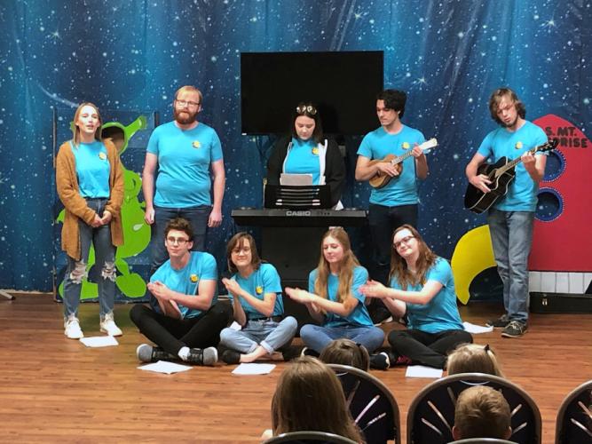 SFA theatre students on the road in Mount Enterprise performing scenes from "The Reluctant Dragon."