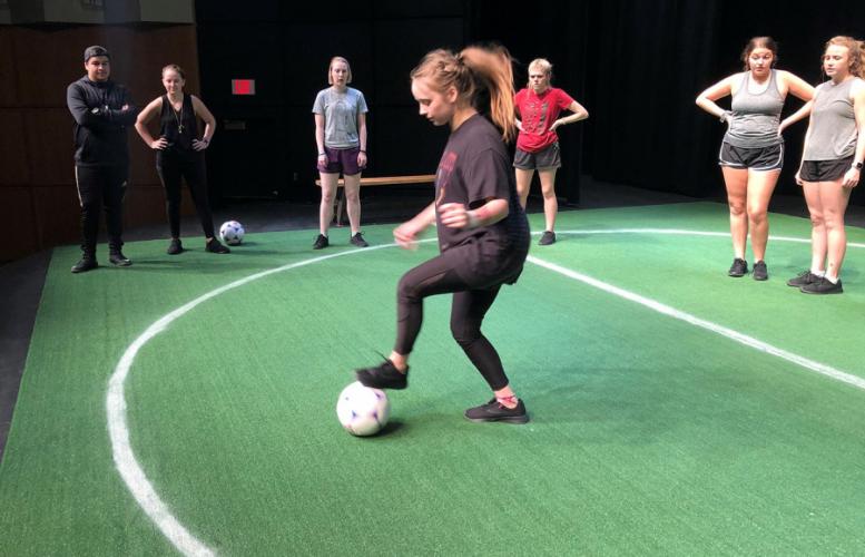 Dallas sophomore Michael Nunez and Colleyville freshman Aubrie Smith run soccer drills with “The Wolves” cast members. 