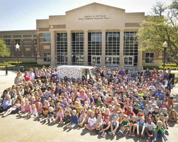 SFA student, ECHL students and faculty in a group photo in front of the ECHL