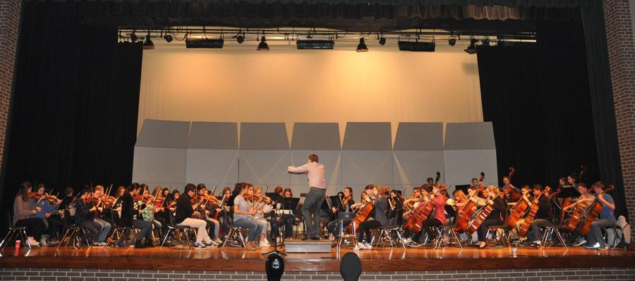 Ryan Ross conducts the high school orchestra at last fall's Regions 4 and 21 clinic and concert at Longview High School.