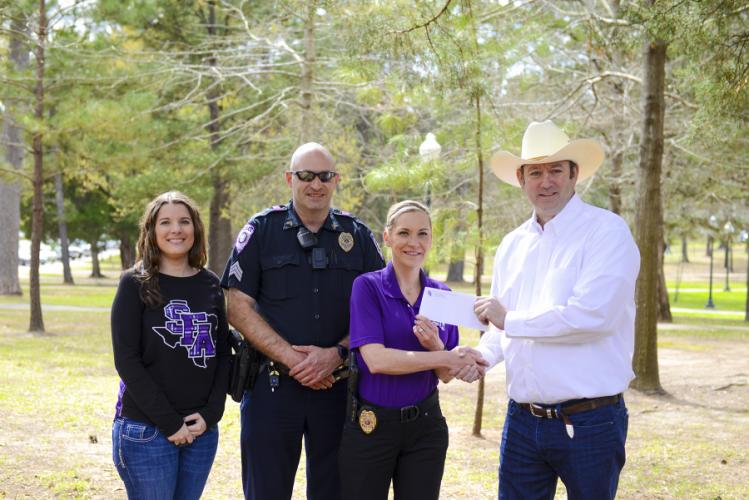 Heather Howell, former scholarship recipient; William Hartley, a sergeant with SFA’s University Police Department; Amanda Kennedy, assistant chief of UPD; and Clayton Lowery