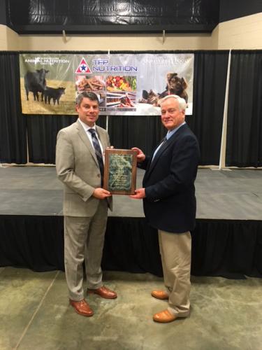 Dr. Craig Morton receives the award from Cory Beasley of Citizen’s 1st Bank, sponsor of the annual award.